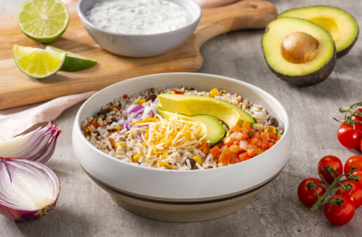 southwest-rice-and-beans-bowl-with-avocado-salsa-shredded-mexican-cheese-blend-red-onion-and-cilantro-lime-cream
