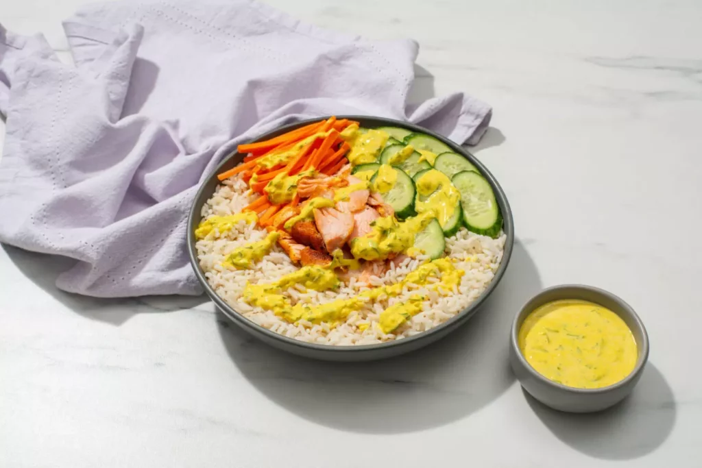 salmon rice bowl with turmeric yogurt drizzle